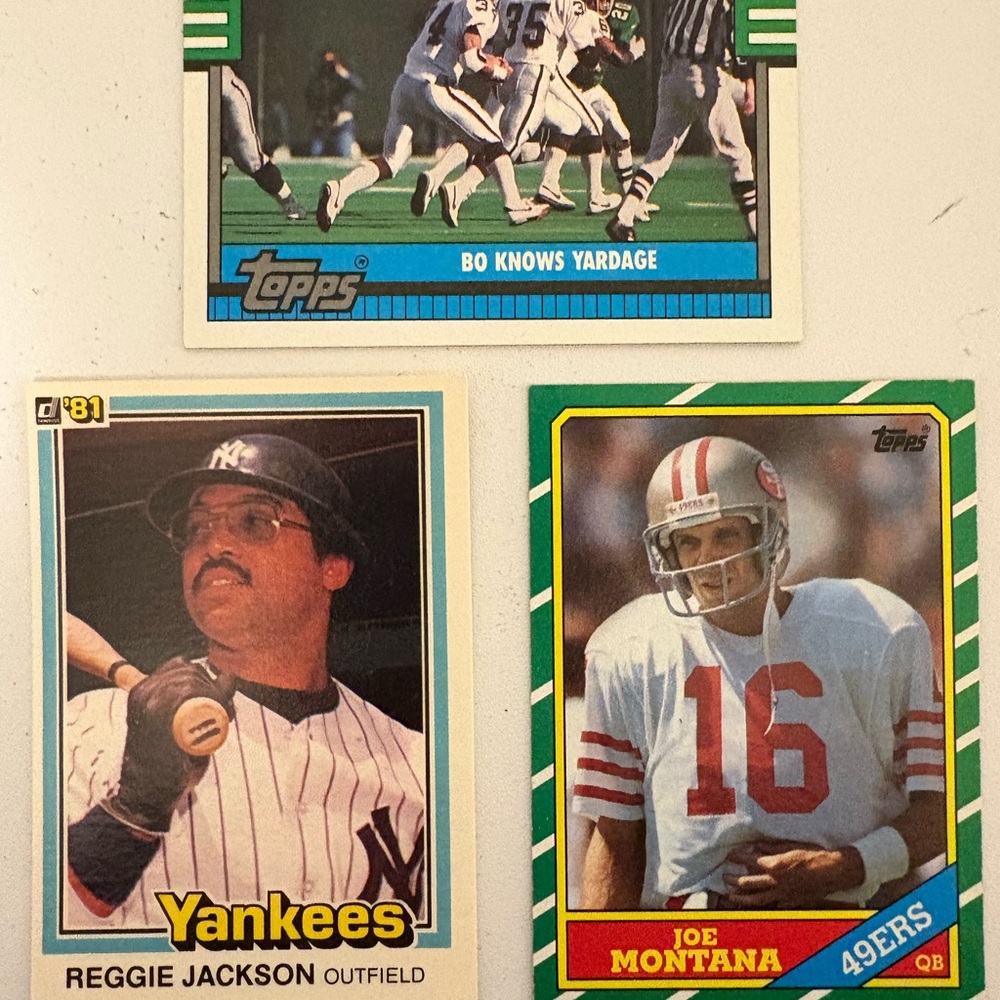 Three Sports Trading Cards: Joe Montana, Bo Jackson (Football), Reggie Jackson
